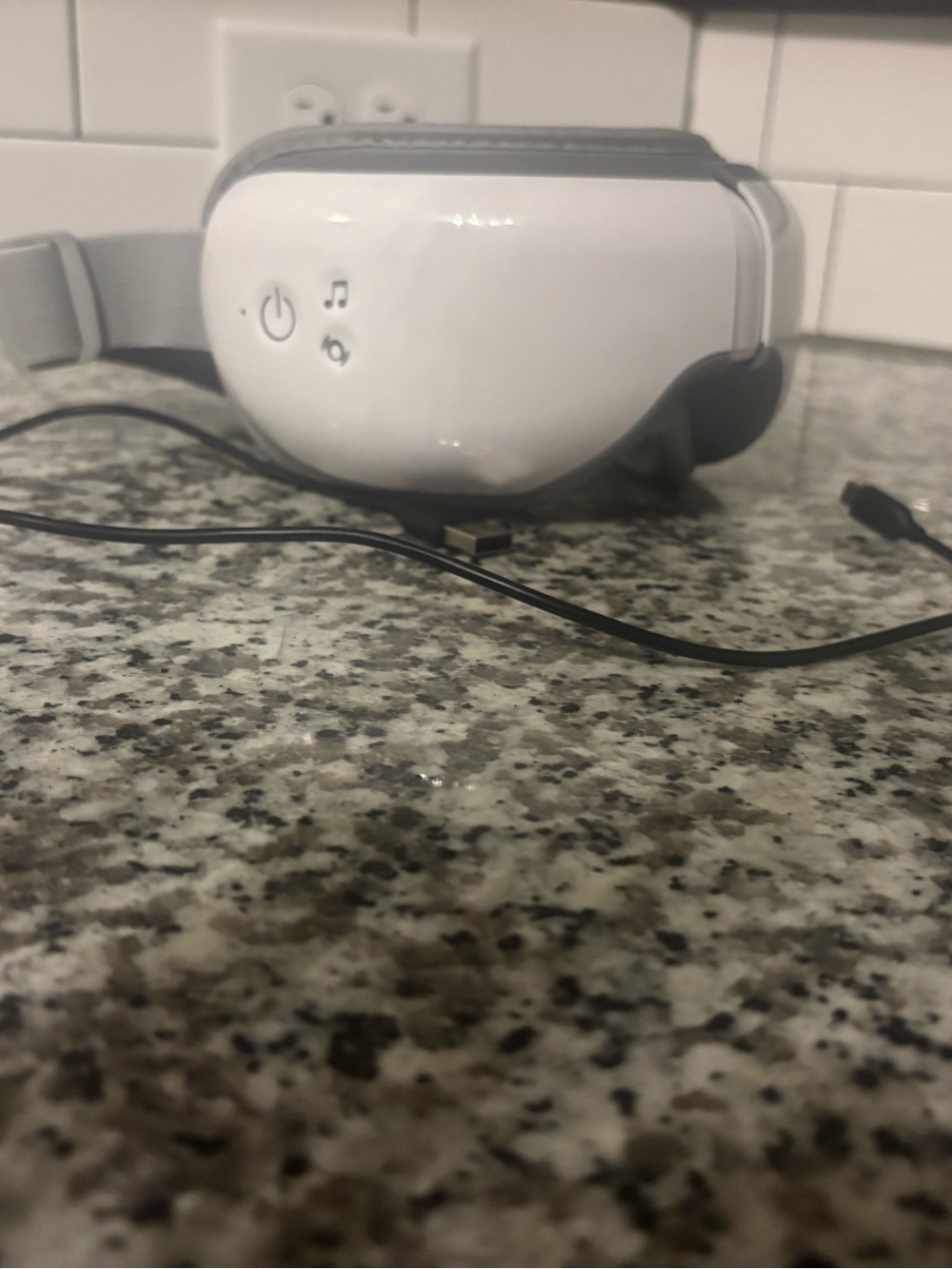 Renpho eye massager with USB charger. Vibrates, massages, plays relaxing music